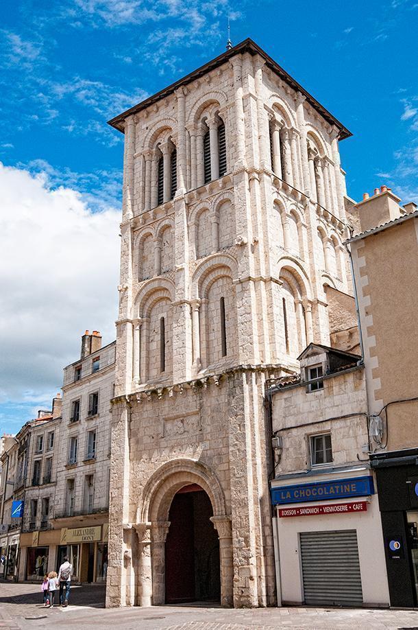 The Cure de Saint Porchaire on a busy shopping street in Poitiers, France