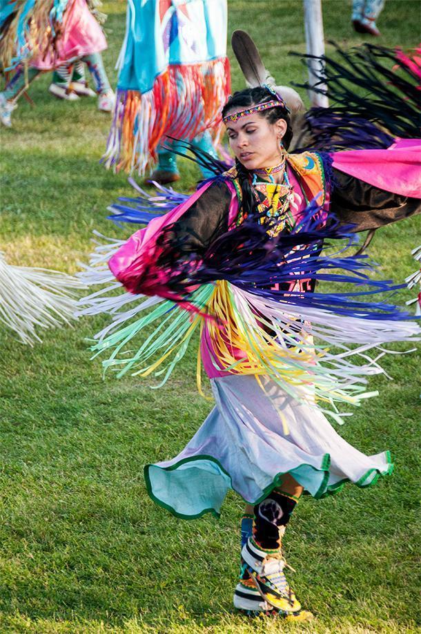 The twirling colours of the Shawl Dance at the Saint Mary's Powwow