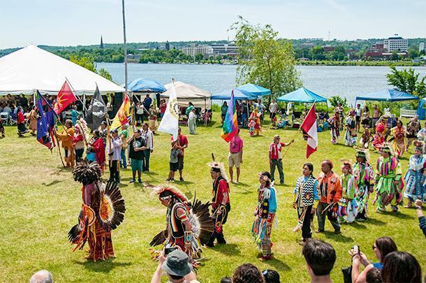 A host of diverse flags wave over the Saint Mary's First Nation Powwow