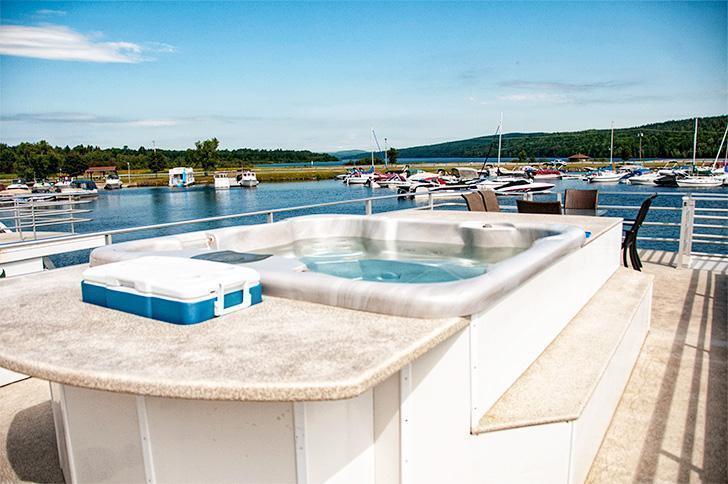 On the Lakeway Houseboat's roof is a hot tub and bar for the ultimate relaxation